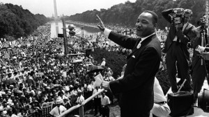 The civil rights leader Martin Luther KIng (C) waves to supporters 28 August 1963 on the Mall in Washington DC (Photo: AFP/Getty Images)